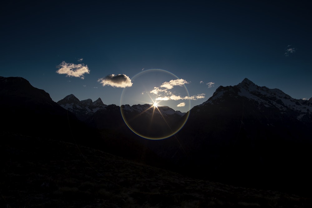 silhouette of mountains during golden house