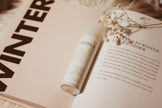 Caudalie bottle on book