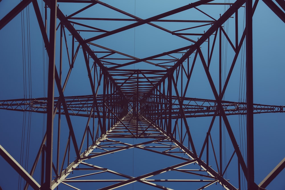 low angle photography of black transmission tower