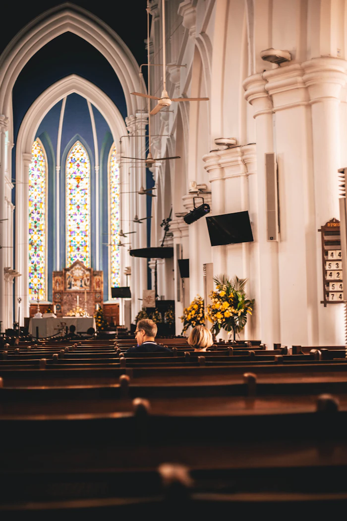 free catholic dating websites – couple sitting together inside a church