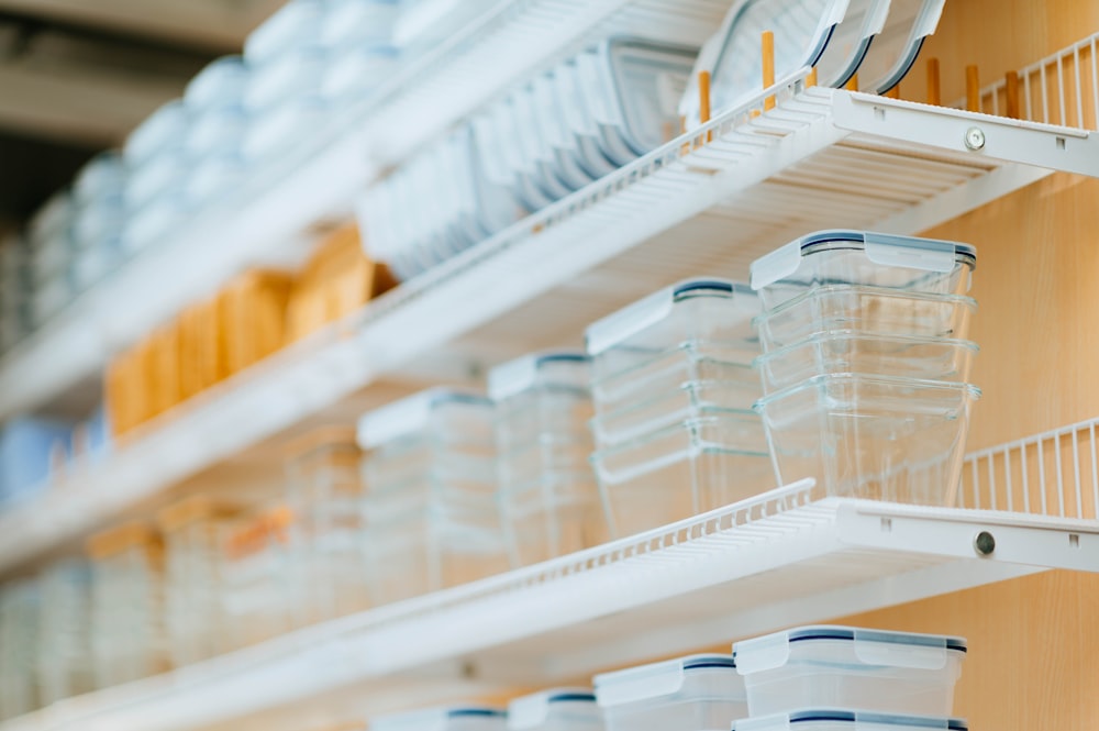 clear glass containers on display shelves