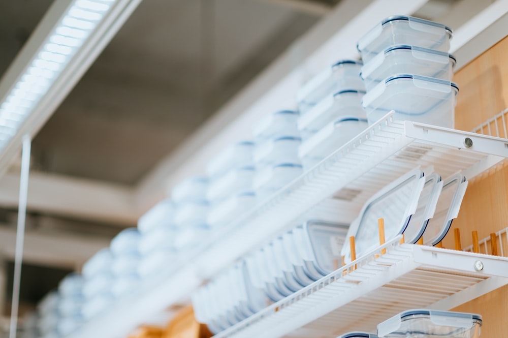 white plastic containers on rack