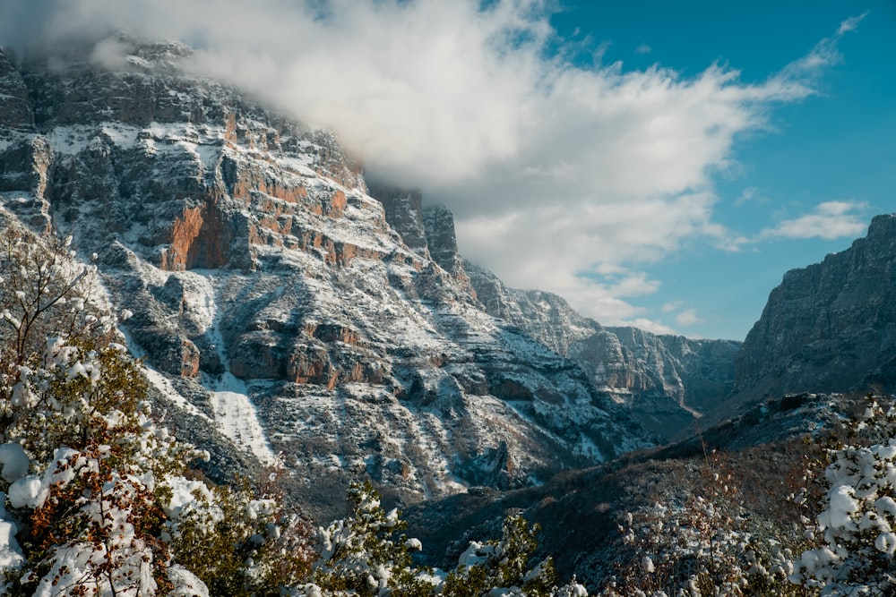 snow covered gray rocky mountain during daytime