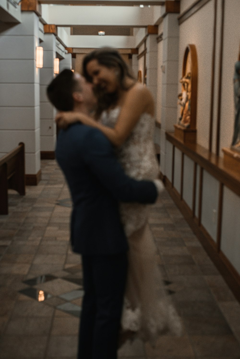 man carrying a woman at hallway