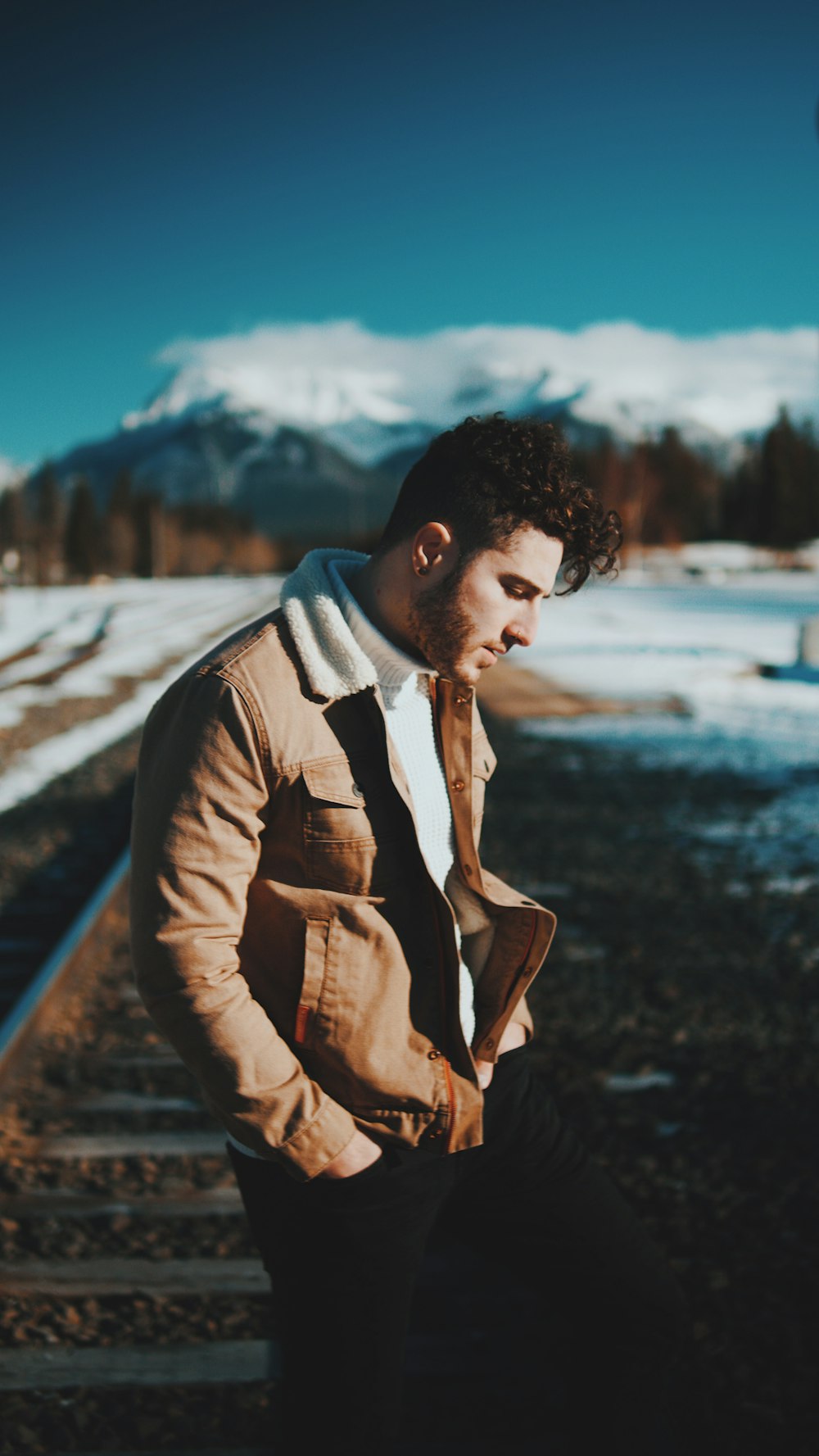 man in brown leather jacket