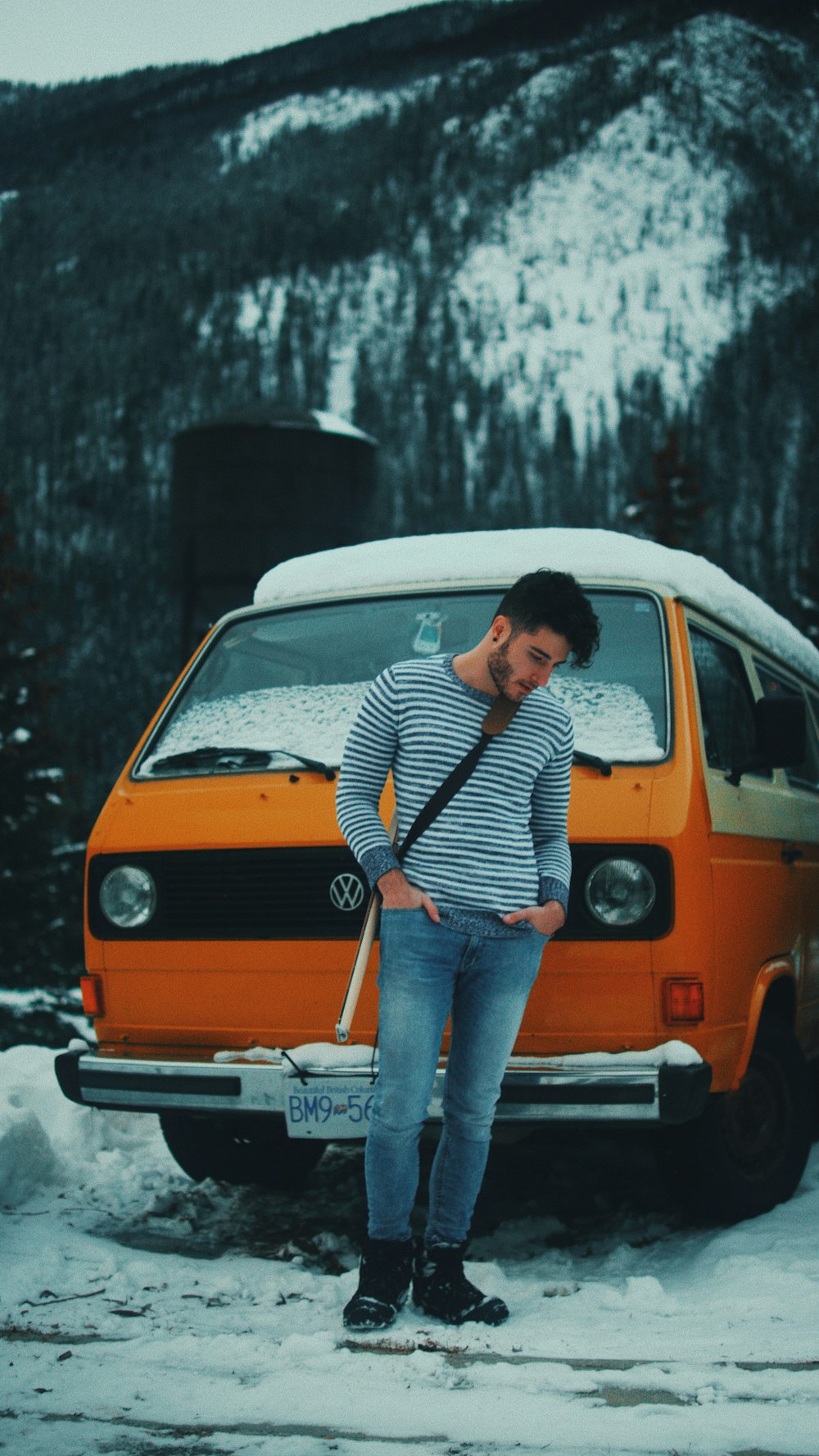 woman standing in front of Volkswagen T3