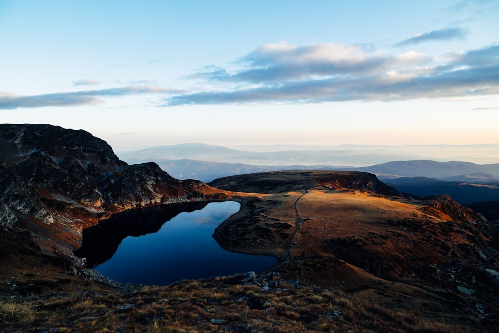 lake on top of mountain in nature photography