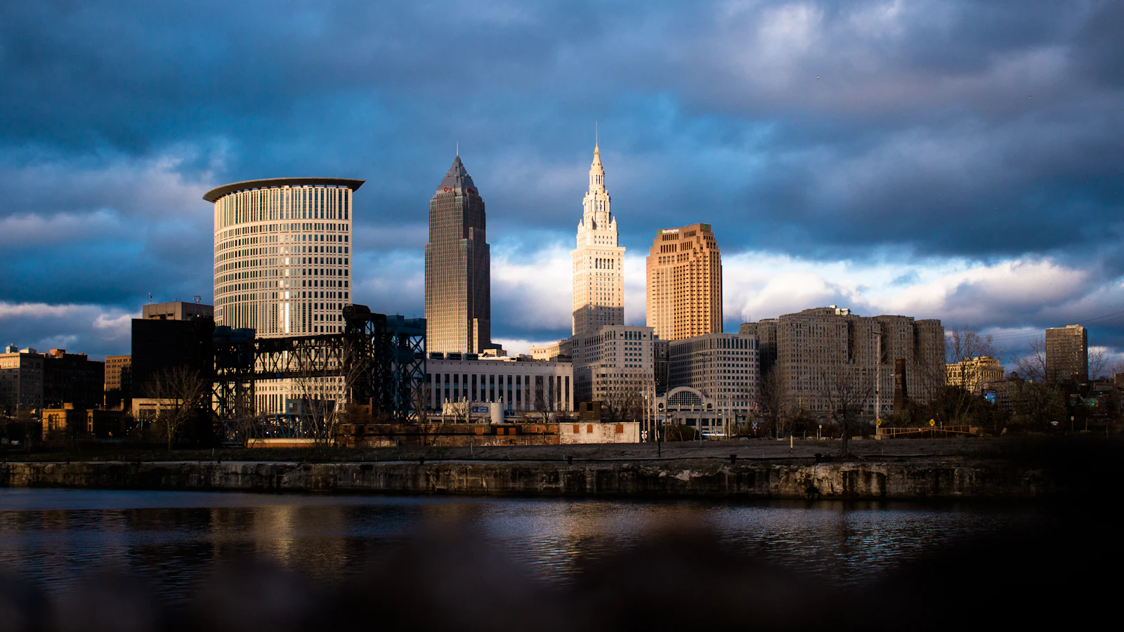 The downtown Cleveland skyline at dusk, seen from across the river.