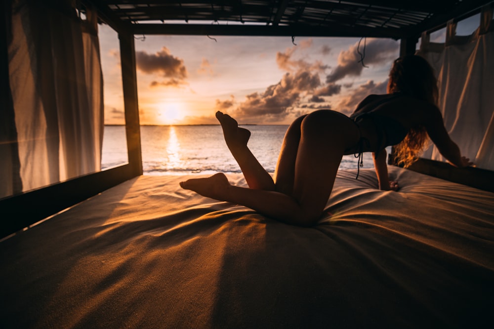 woman on bed frame