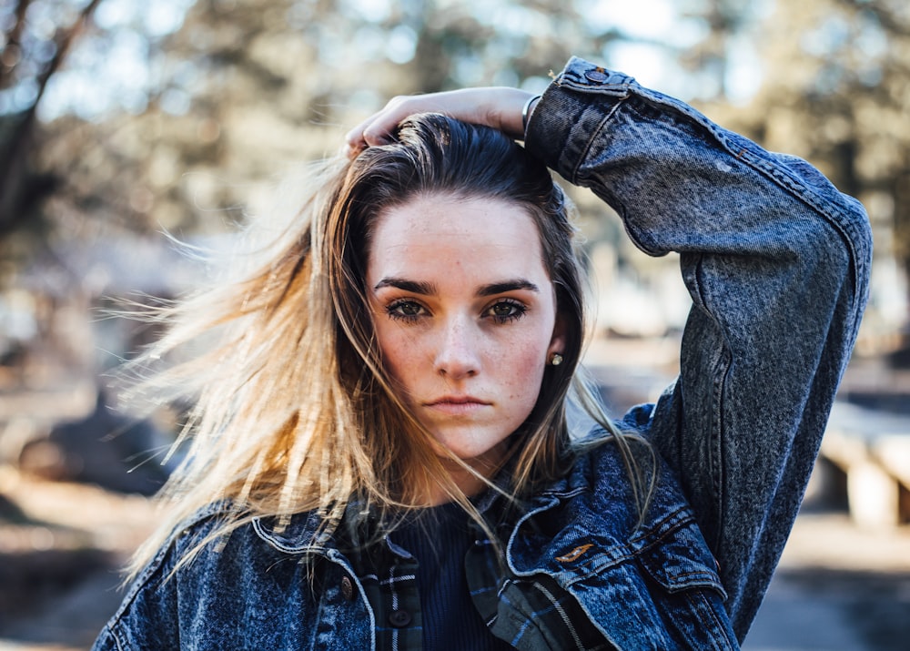 woman wearing blue denim jacket