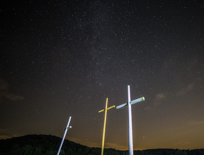 three yellow and white cross