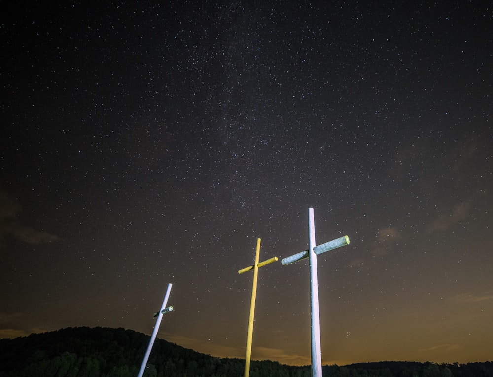 three yellow and white cross