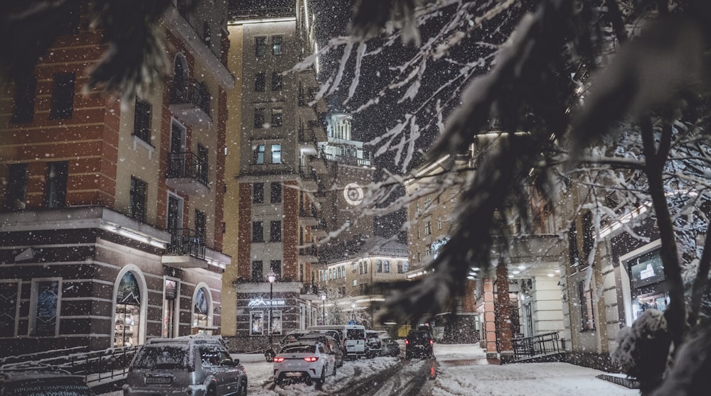 vehicle running on snowy road during nighttime