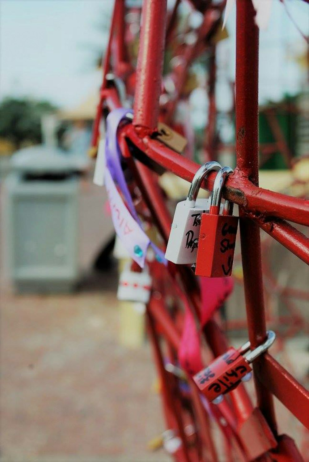 padlocks on red metal frame
