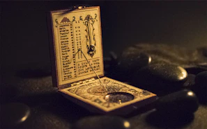 brown and black wooden measuring device