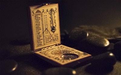 brown and black wooden measuring device