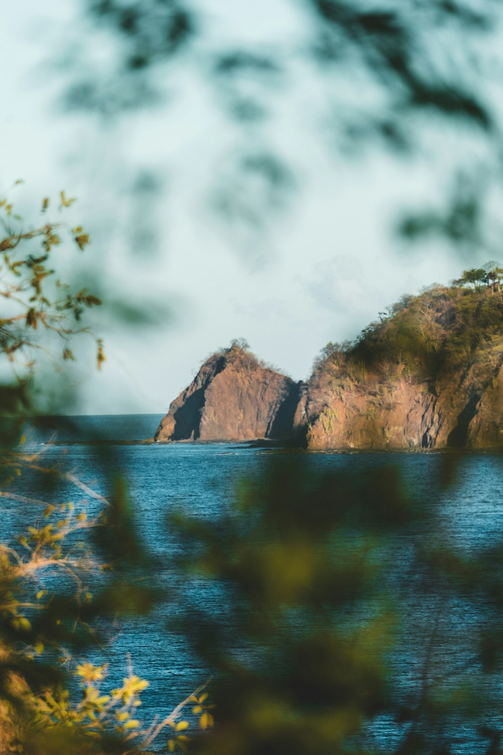 brown cliff near water