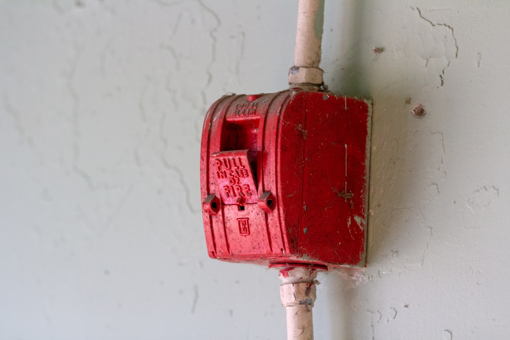 close up photo of red metal corded case