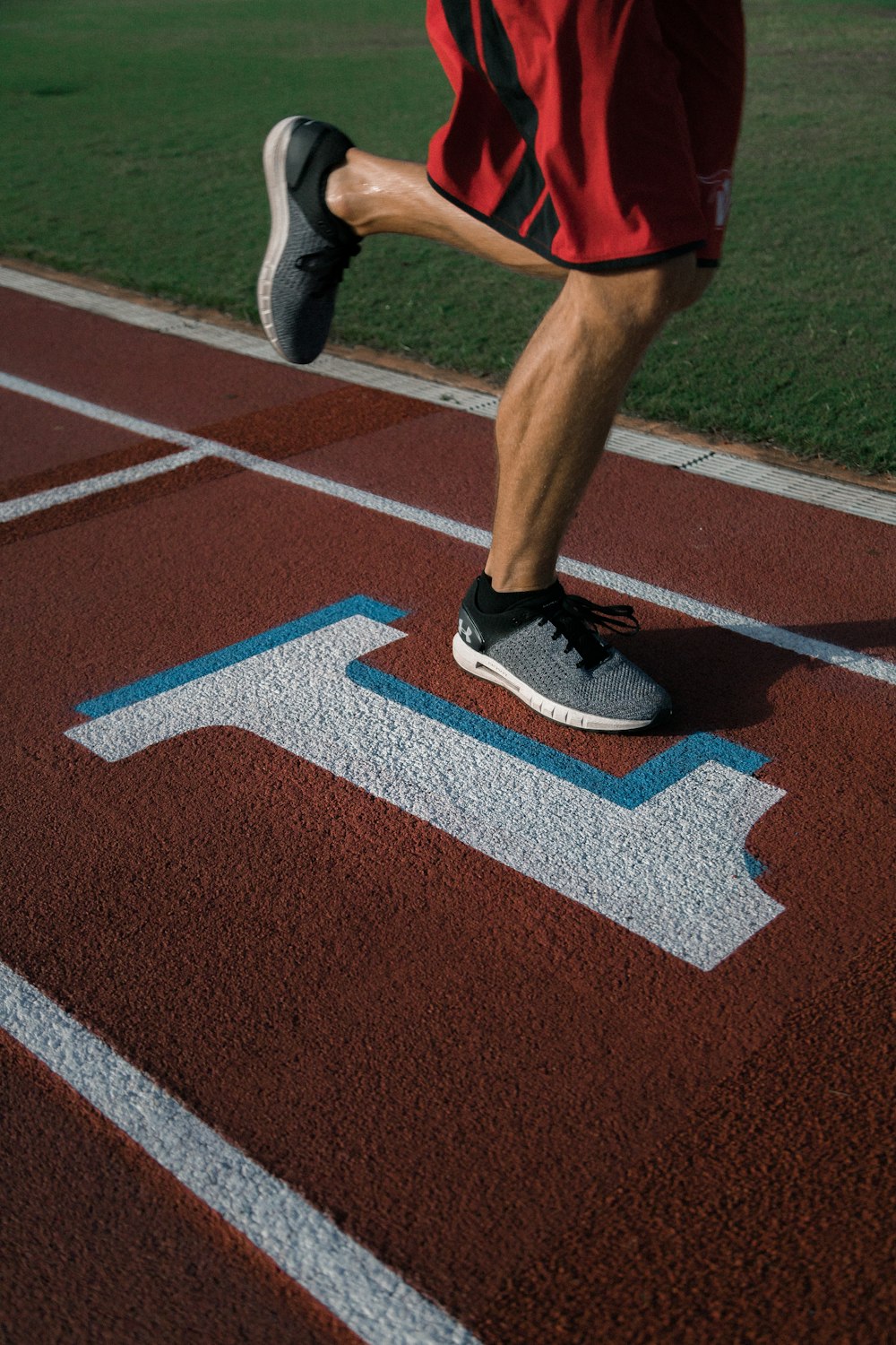 person running on tracking field