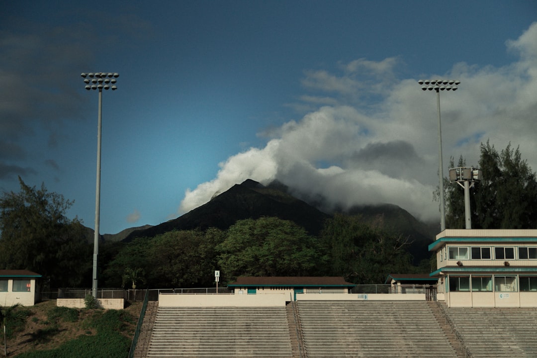 mountain blowing smoke during daytime