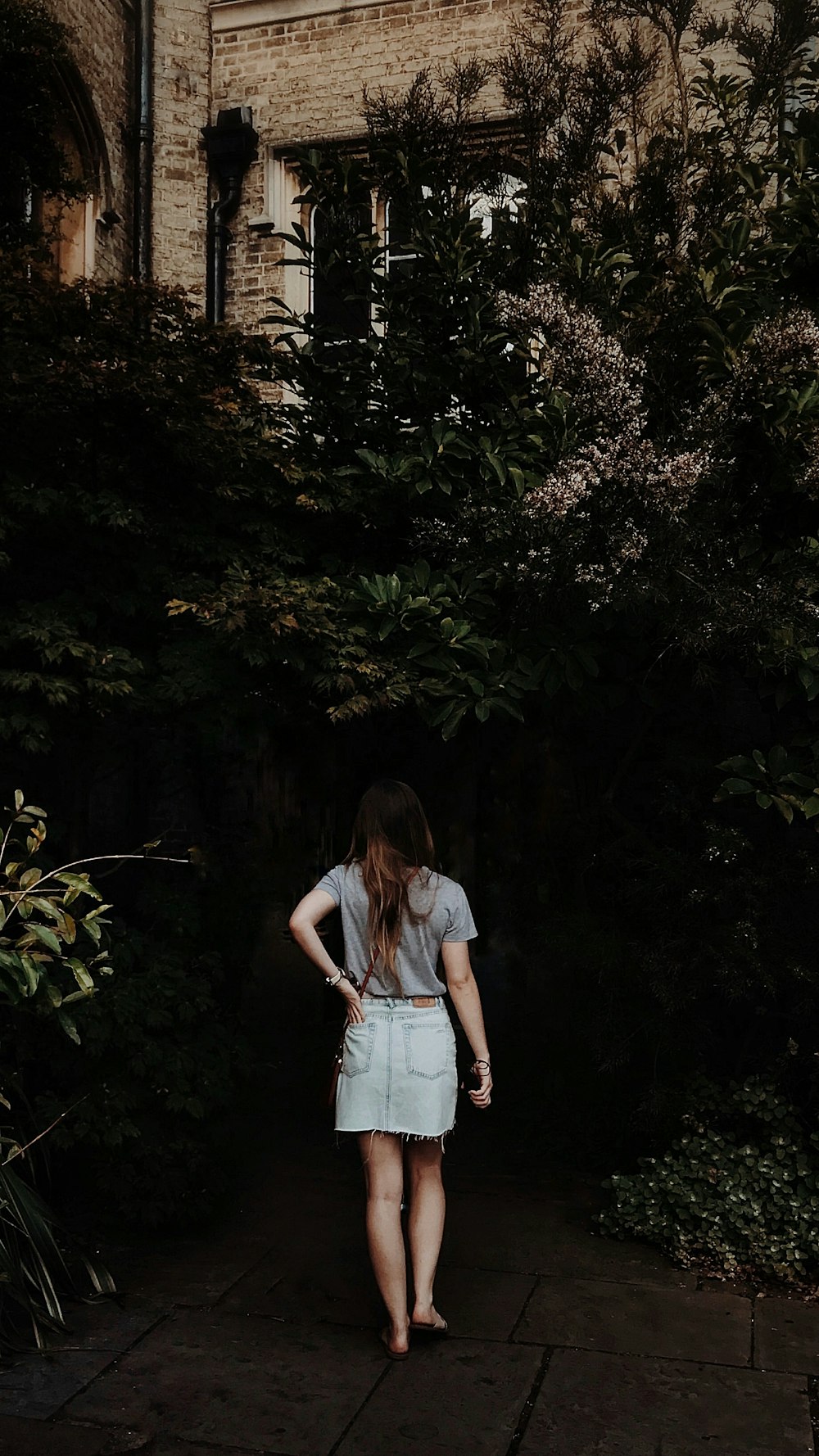 woman walking in flower garden