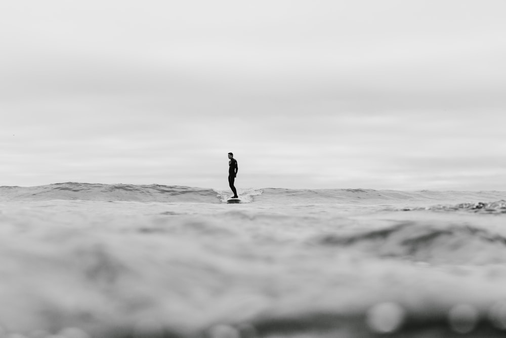 man surfing on sea