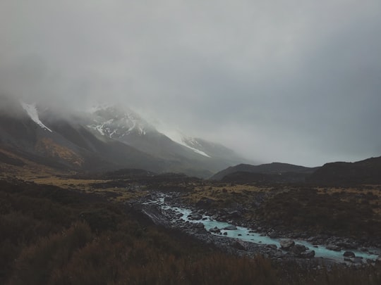 mountain covered with fogs in Hooker Valley Track New Zealand