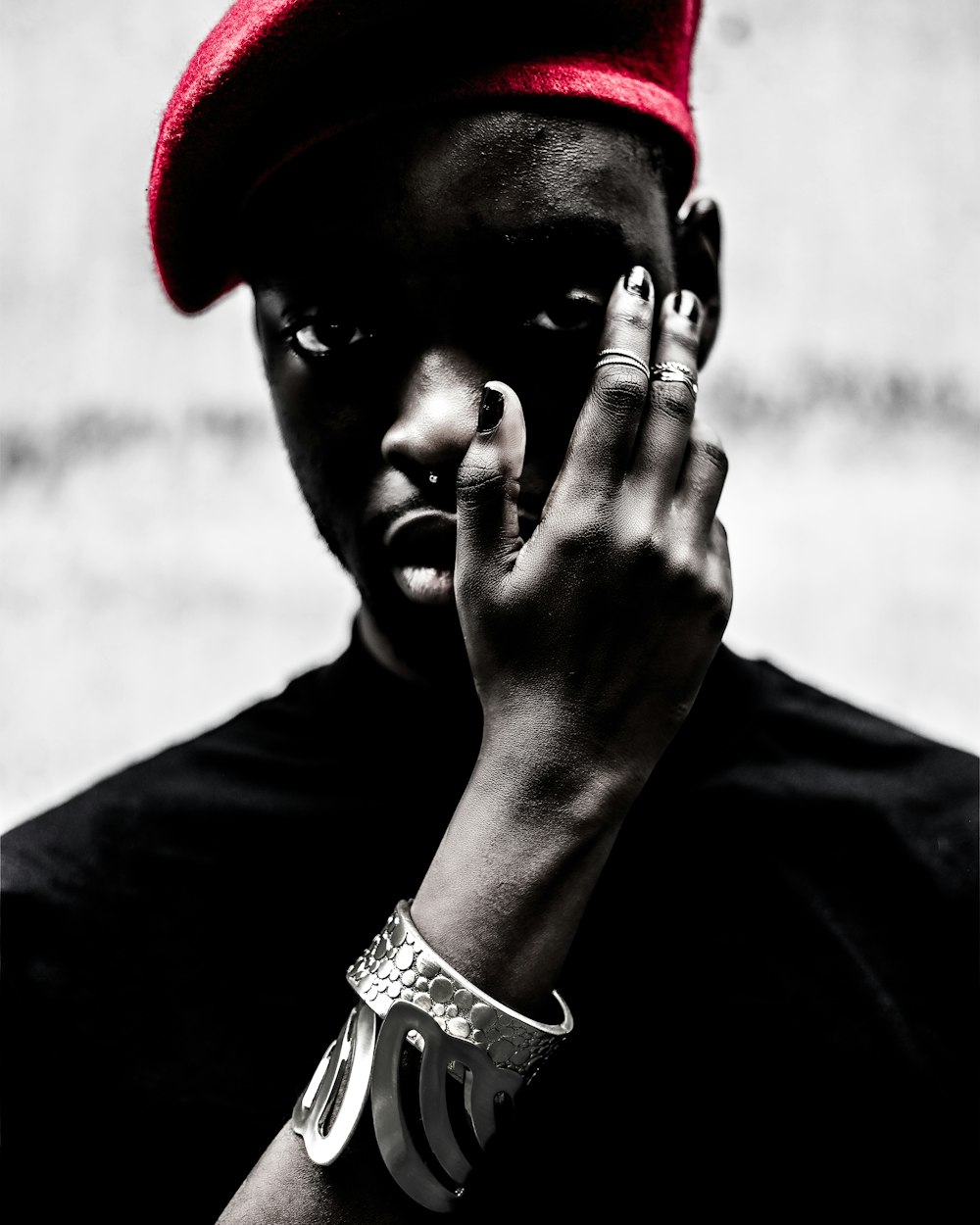 selective color photography of man with red cap