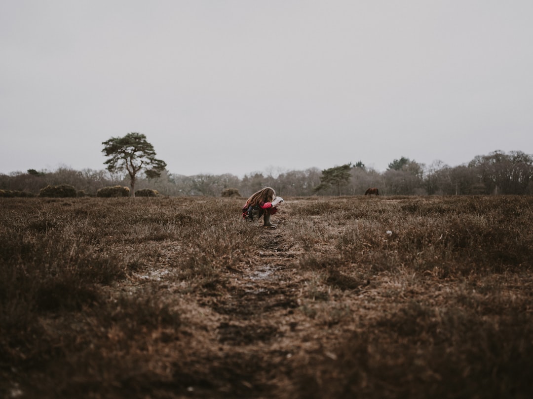 woman sitting on ground