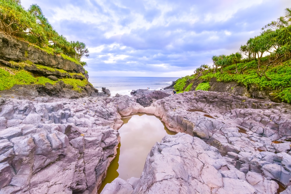 body of water surrounded by tock