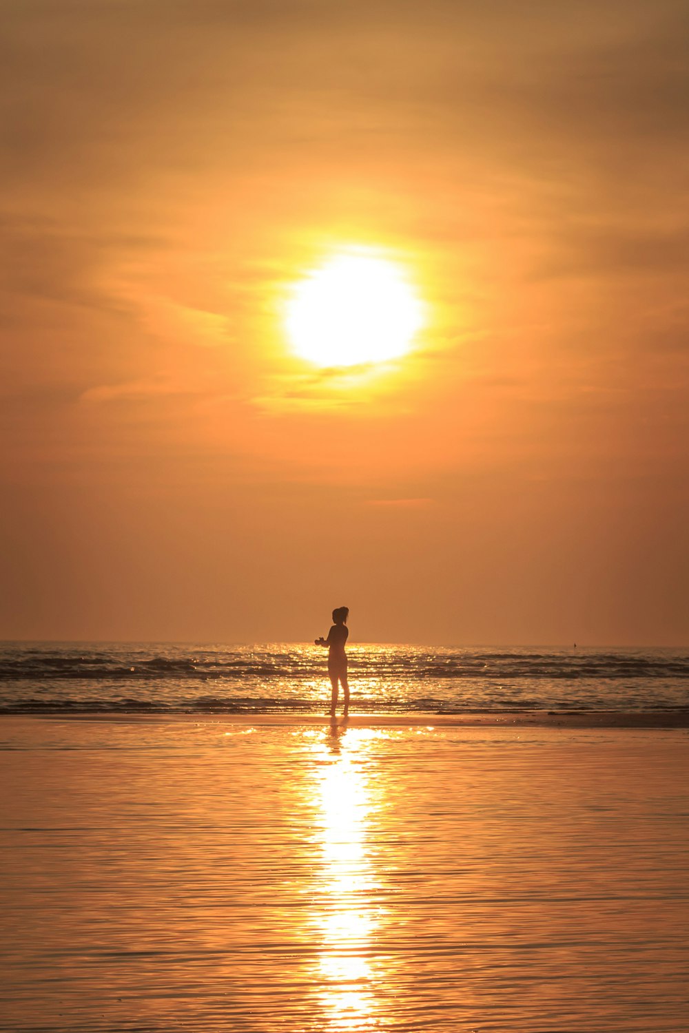 person standing near seashore