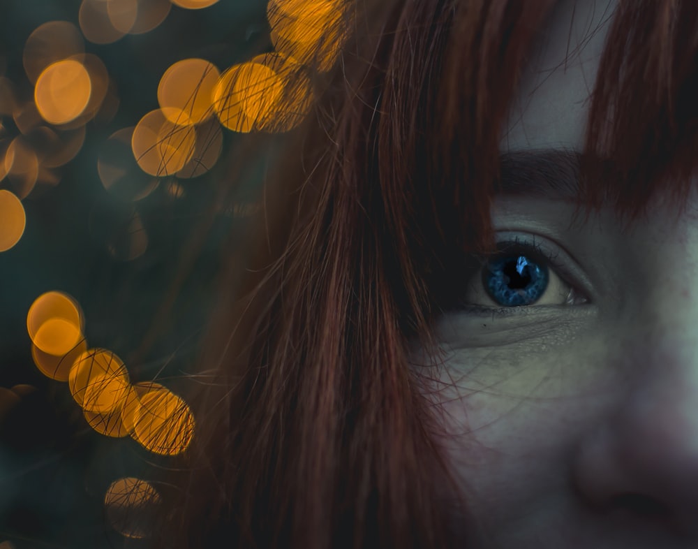 close up photo of red haired woman