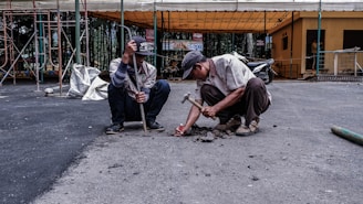 two men fixing the road