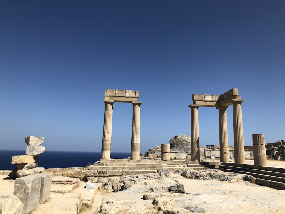 white destroyed towers near sea