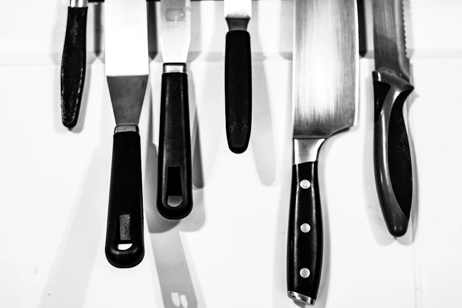 Chef and paring knives arranged on a white surface