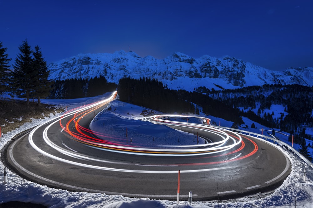 time-lapse photography of curve road
