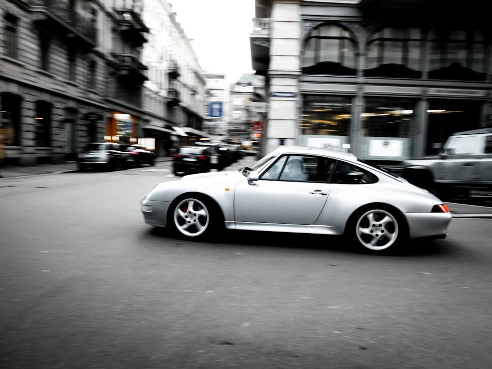 silver coupe at street