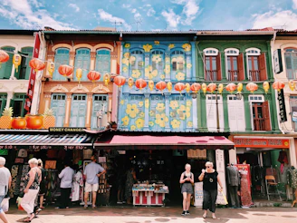 people at multicolored painted store during daytie