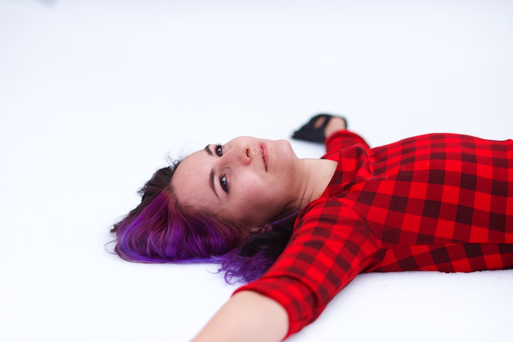 woman lying down while smiling