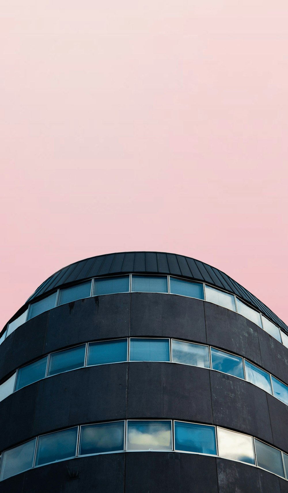 black and blue glass high-rise building