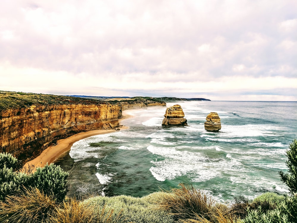 sea and rock formation during daytime