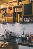 Cozy residential kitchen featuring carefully laid subway tiles around the countertop.