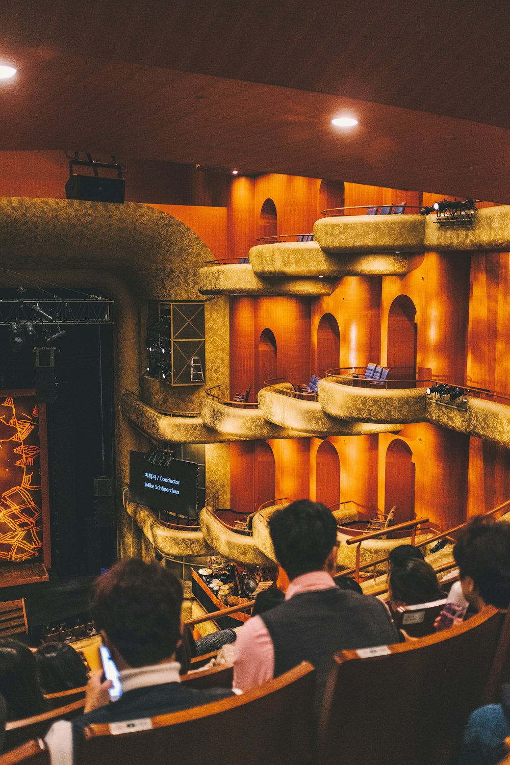 people sitting on theater chairs