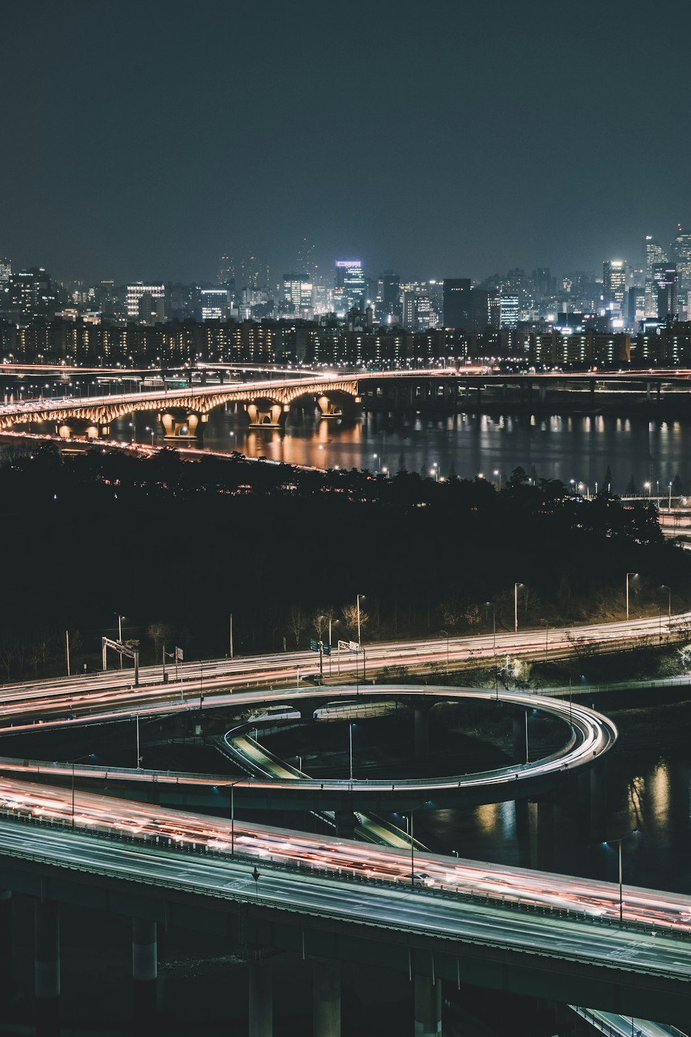 cars on bridge at nighttime