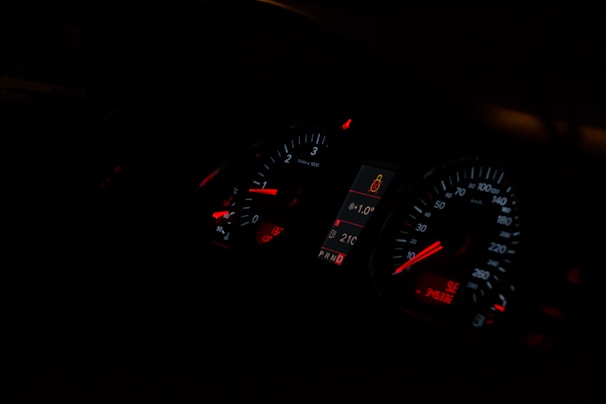 Close-up of a vehicle dashboard displaying technical data and restriction alerts