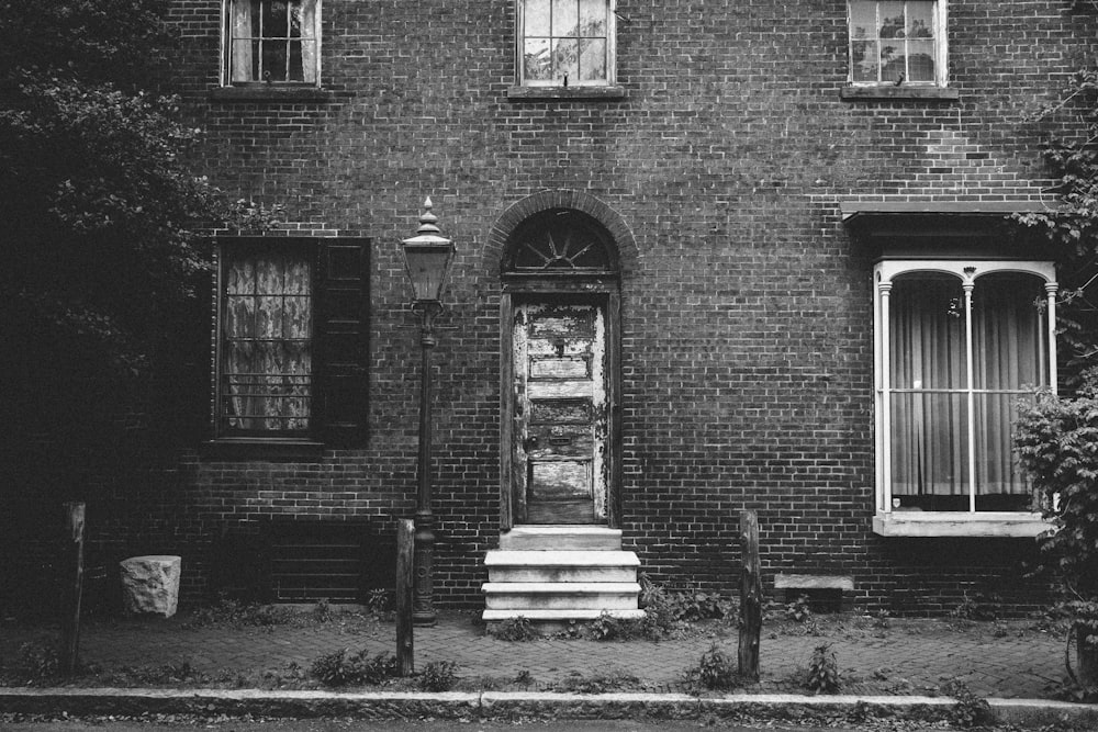 grayscale photo of house front