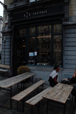 A cozy café terrace where friends share stories over coffee.