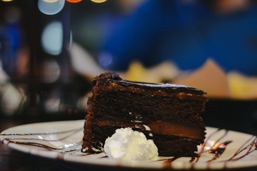 An inviting dessert featuring a rich chocolate cake slice.