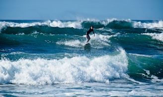 person surfing during daytime