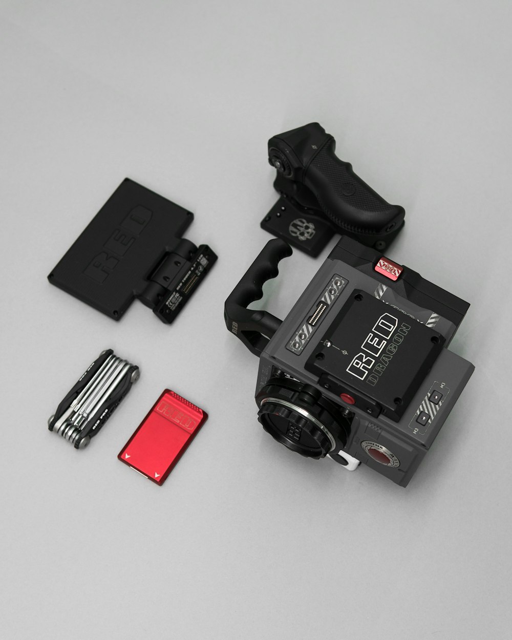 flat lay photography of black Red TV camcorder set